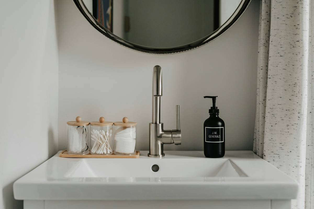 Modern double vanity with dual LED mirrors and organized skincare zones
