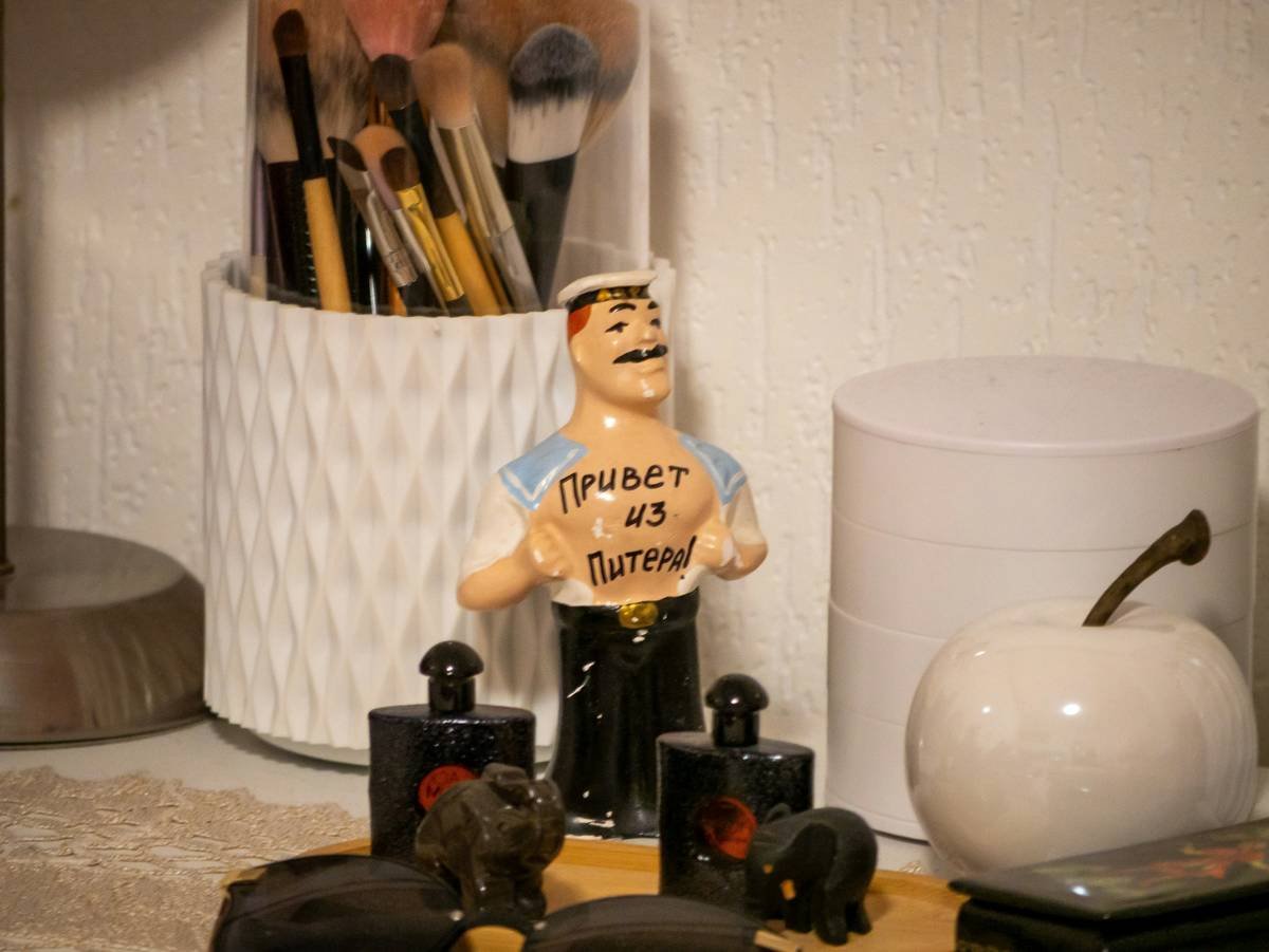 Side-by-side: cluttered vanity vs. organized cosmetic storage unit with labeled drawers, built-in lighting, and brush holders