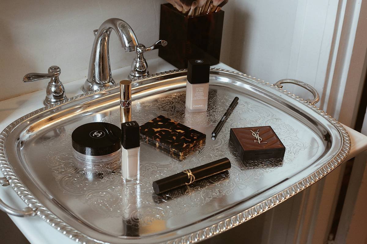Before and after of a vanity using a smart makeup organizer box system with categorized sections for brushes, palettes, and skincare